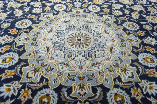 Central medallion detail of 2000s Kashan rug from Iran / Persia