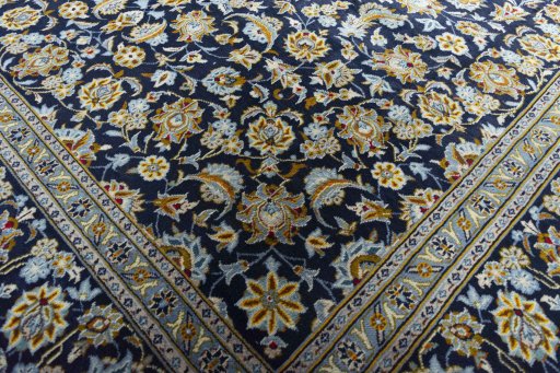 Close-up detail of 2000s Kashan rug from Iran / Persia showing Wool weave