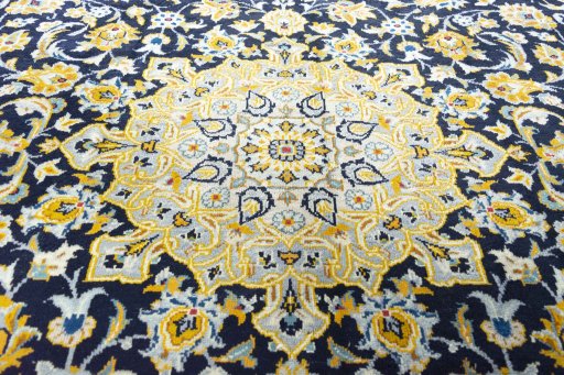 Central medallion detail of 2000s Kashan rug from Iran / Persia