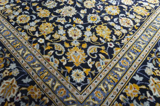 Close-up detail of 2000s Kashan rug from Iran / Persia showing Wool weave