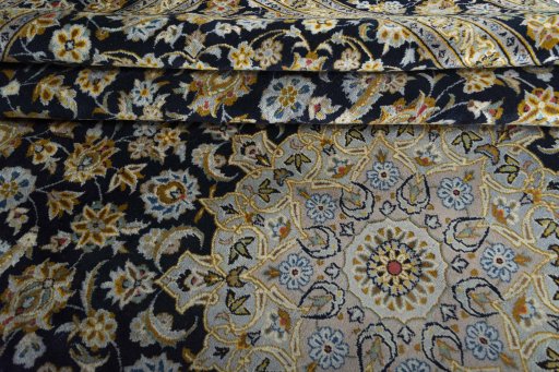 Close-up detail of 2000s Kashan rug from Iran / Persia showing Wool weave