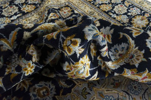 Surface texture of 2000s Kashan rug with natural Wool and intricate pattern