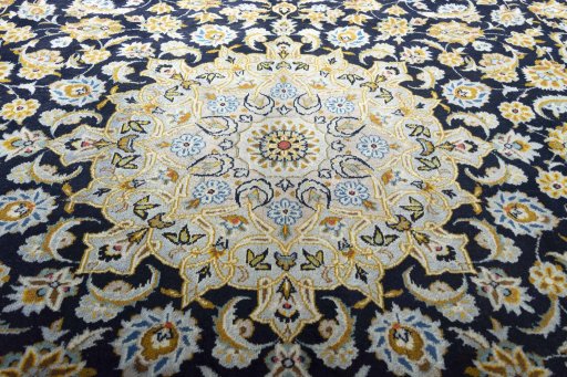 Central medallion detail of 2000s Kashan rug from Iran / Persia