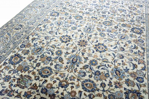 Backside of handmade 2000s Kashan rug showing knot structure and weave density