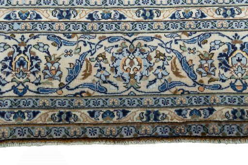 Close-up detail of 2000s Kashan rug from Iran / Persia showing Wool weave