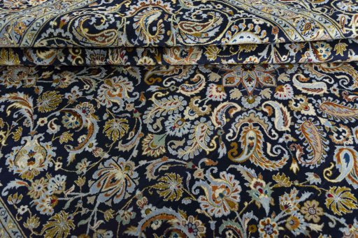 Close-up detail of 2000s Kashan rug from Iran / Persia showing Wool weave