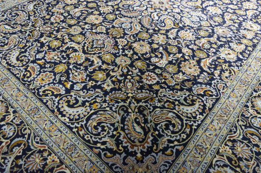 Close-up detail of 2000s Kashan rug from Iran / Persia showing Wool weave