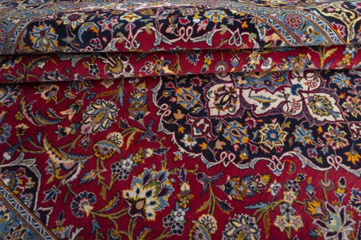 Close-up detail of 2000s Kashan rug from Iran / Persia showing Wool weave
