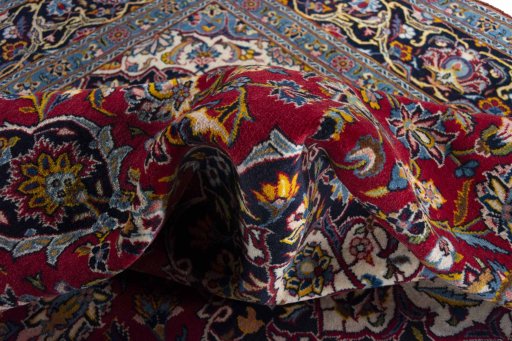 Surface texture of 2000s Kashan rug with natural Wool and intricate pattern