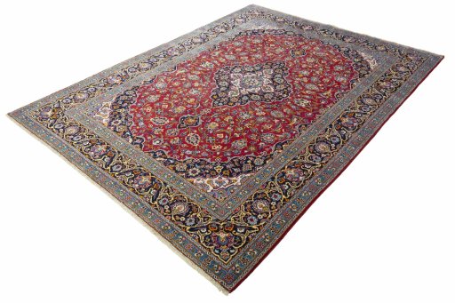 Corner detail of 2000s Kashan rug showing border pattern and Wool pile