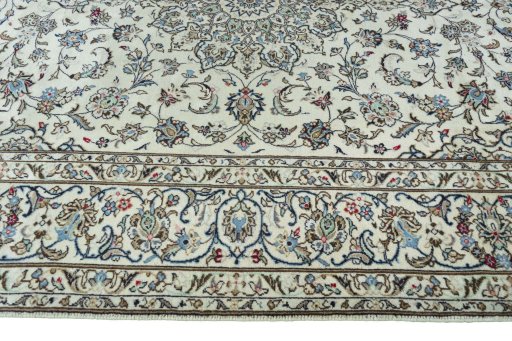 Corner detail of 2000s Kashan rug showing border pattern and Wool pile