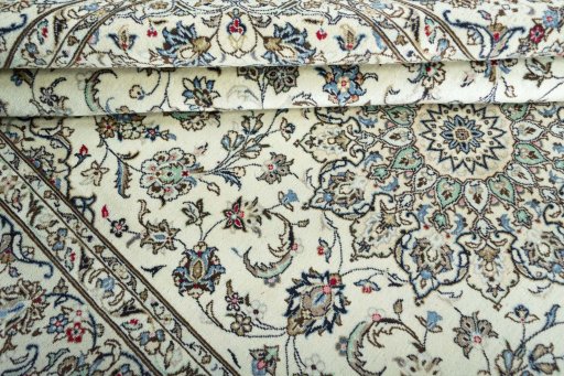 Close-up detail of 2000s Kashan rug from Iran / Persia showing Wool weave