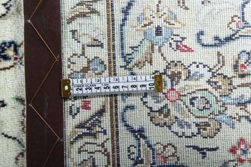 Backside of handmade 2000s Kashan rug showing knot structure and weave density