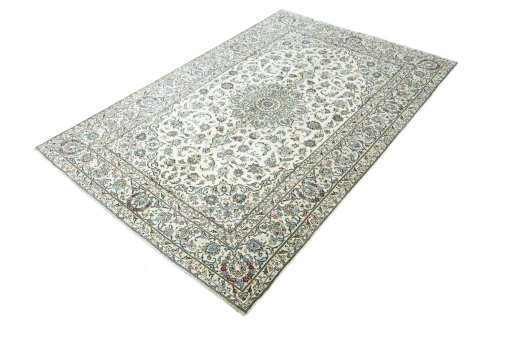 Corner detail of 2000s Kashan rug showing border pattern and Wool pile