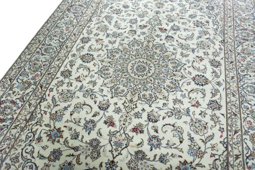 Backside of handmade 2000s Kashan rug showing knot structure and weave density