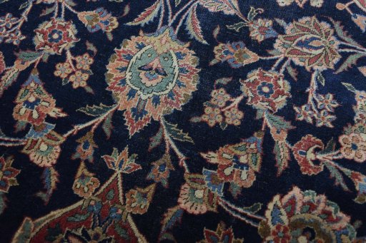 Corner detail of 1930s Kashan rug showing border pattern and Wool pile