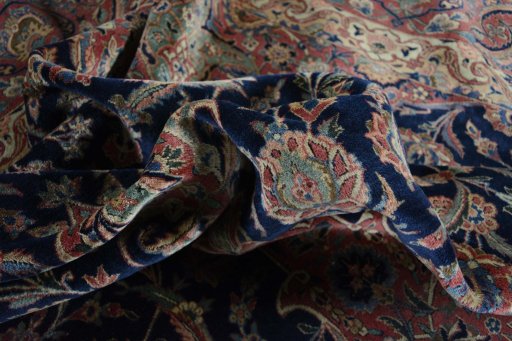 Close-up detail of 1930s Kashan rug from Iran / Persia showing Wool weave