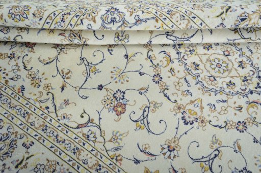 Close-up detail of 2000s Kashan rug from Iran / Persia showing Wool weave