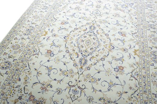 Backside of handmade 2000s Kashan rug showing knot structure and weave density
