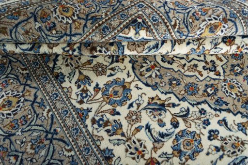 Close-up detail of 2000s Kashan rug from Iran / Persia showing Wool weave