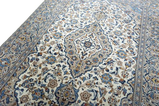 Backside of handmade 2000s Kashan rug showing knot structure and weave density