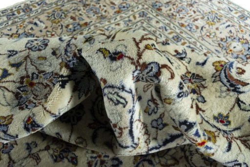 Surface texture of 2000s Kashan rug with natural Wool and intricate pattern