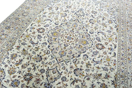 Backside of handmade 2000s Kashan rug showing knot structure and weave density