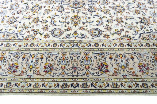Corner detail of 2000s Kashan rug showing border pattern and Wool pile