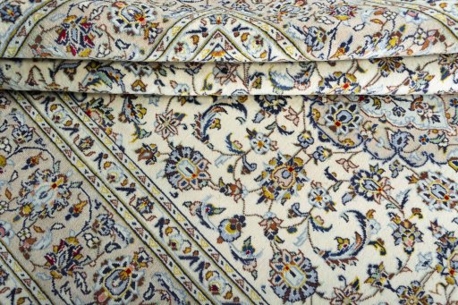 Close-up detail of 2000s Kashan rug from Iran / Persia showing Wool weave