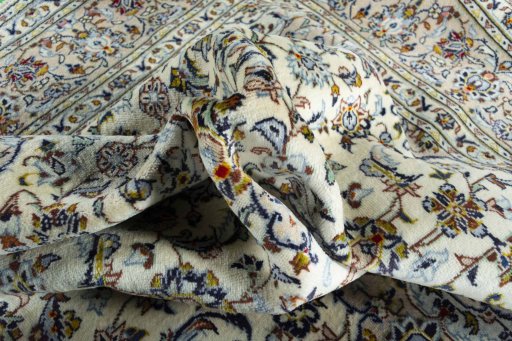 Surface texture of 2000s Kashan rug with natural Wool and intricate pattern