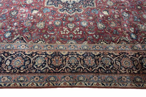 Corner detail of 1930s Kashan rug showing border pattern and Wool pile