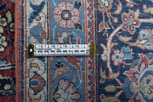 Backside of handmade 1930s Kashan rug showing knot structure and weave density