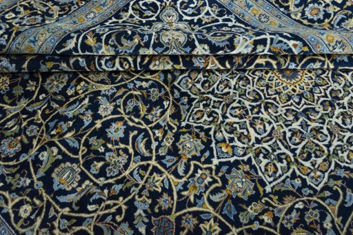 Close-up detail of 2000s Kashan rug from Iran / Persia showing Wool weave