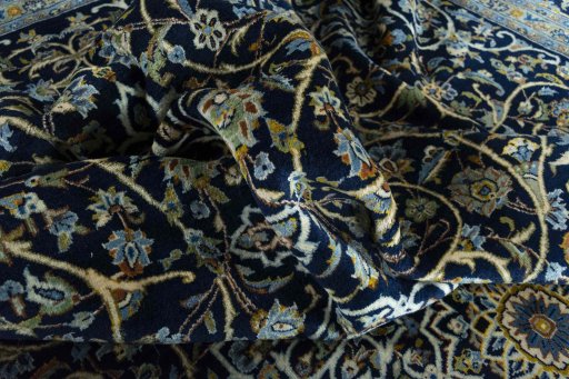 Surface texture of 2000s Kashan rug with natural Wool and intricate pattern