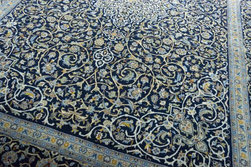 Close-up detail of 2000s Kashan rug from Iran / Persia showing Wool weave