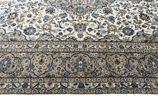 Corner detail of 2000s Kashan rug showing border pattern and Wool pile