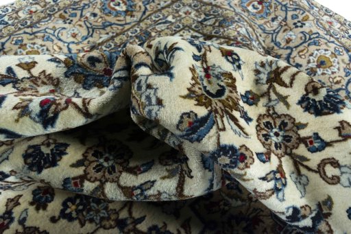 Surface texture of 2000s Kashan rug with natural Wool and intricate pattern