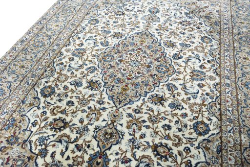 Backside of handmade 2000s Kashan rug showing knot structure and weave density