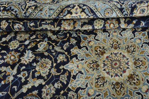 Close-up detail of 2000s Kashan rug from Iran / Persia showing Wool weave