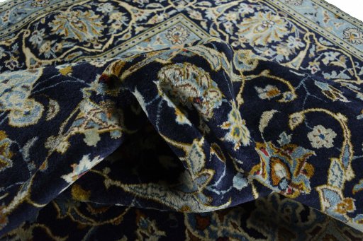 Surface texture of 2000s Kashan rug with natural Wool and intricate pattern