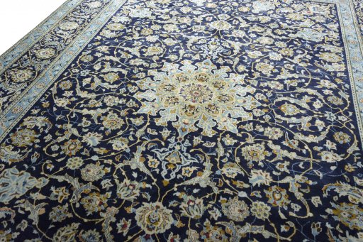 Backside of handmade 2000s Kashan rug showing knot structure and weave density