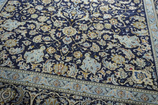 Close-up detail of 2000s Kashan rug from Iran / Persia showing Wool weave