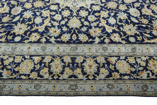 Close-up detail of 2000s Kashan rug from Iran / Persia showing Wool weave