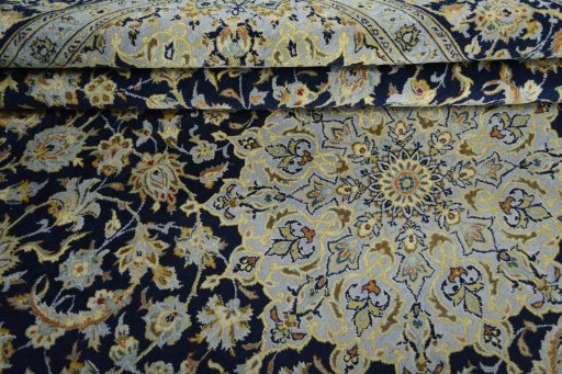 Surface texture of 2000s Kashan rug with natural Wool and intricate pattern