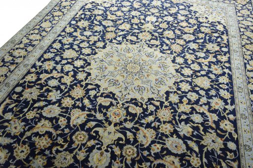 Backside of handmade 2000s Kashan rug showing knot structure and weave density