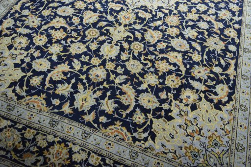 Close-up detail of 2000s Kashan rug from Iran / Persia showing Wool weave