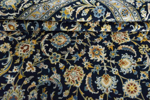 Close-up detail of 2000s Kashan rug from Iran / Persia showing Wool weave