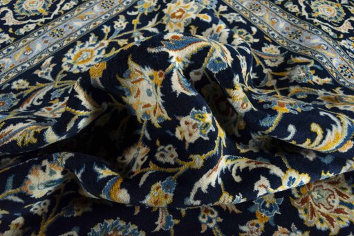 Surface texture of 2000s Kashan rug with natural Wool and intricate pattern