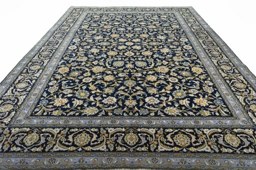 Surface texture of 2000s Kashan rug with natural Wool and intricate pattern