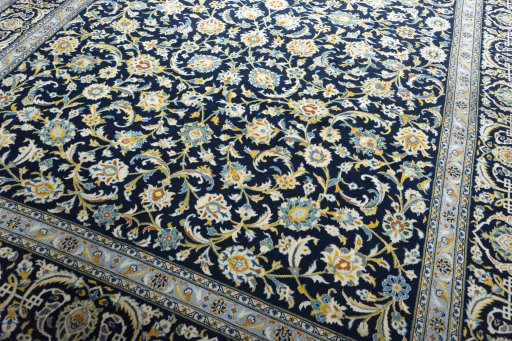 Close-up detail of 2000s Kashan rug from Iran / Persia showing Wool weave